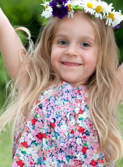 Cute little girl with floral wreath