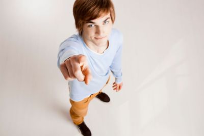 Young man pointing