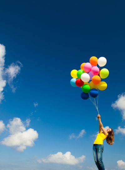 Girl with colorful balloons