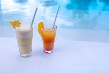 Close-up of two colorful delicious cocktails on the side...