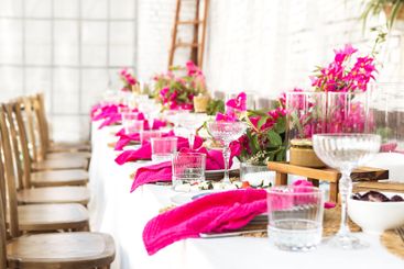 A set festive table in the open air. The table is...