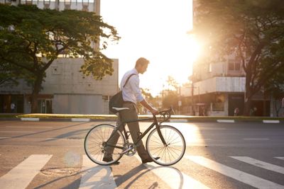 Commute, bike and business man in city for morning,...