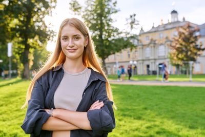 Portrait of young teenage female looking at camera outdoor