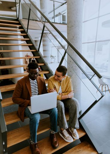 Young African American business man and short hair woman...