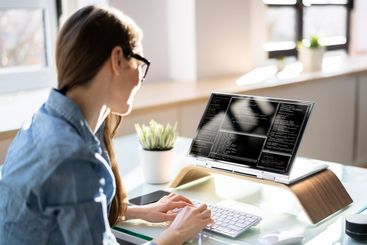 Programmer Or Coder At Office Desk