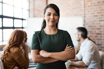 Portrait, office meeting and business woman with arms...