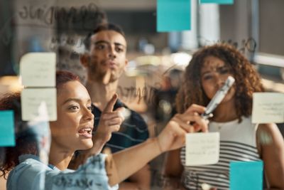 Brainstorming, teamwork and presentation with business...