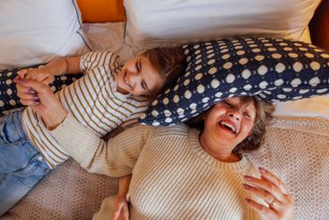 An elderly woman and her sweet granddaughter are having...