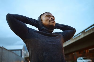 Black man, rest after running and exercise for morning,...